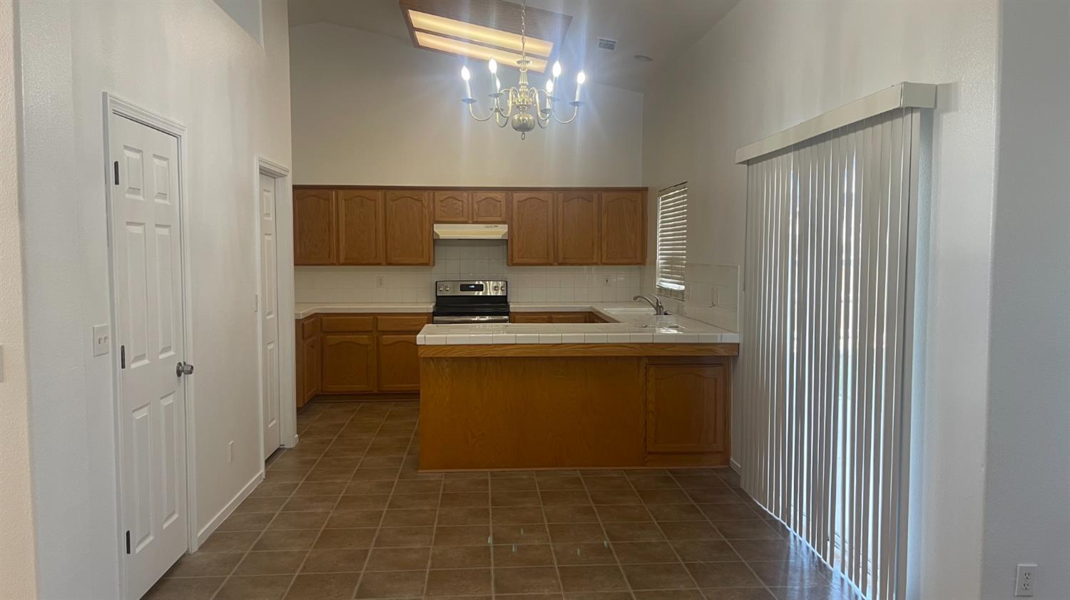 1400 Bay Street Lemoore, CA 93245 - Photo 16 of 21 a bathroom with a sink and a mirror