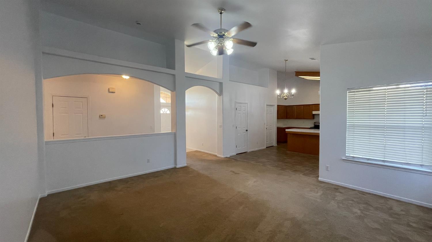 1400 Bay Street Lemoore, CA 93245 - Photo 4 of 21 a view of a livingroom with a ceiling fan and window