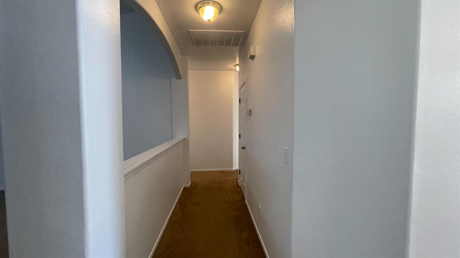 1400 Bay Street Lemoore, CA 93245 - Photo 6 of 21 a view of a hallway with a white walls
