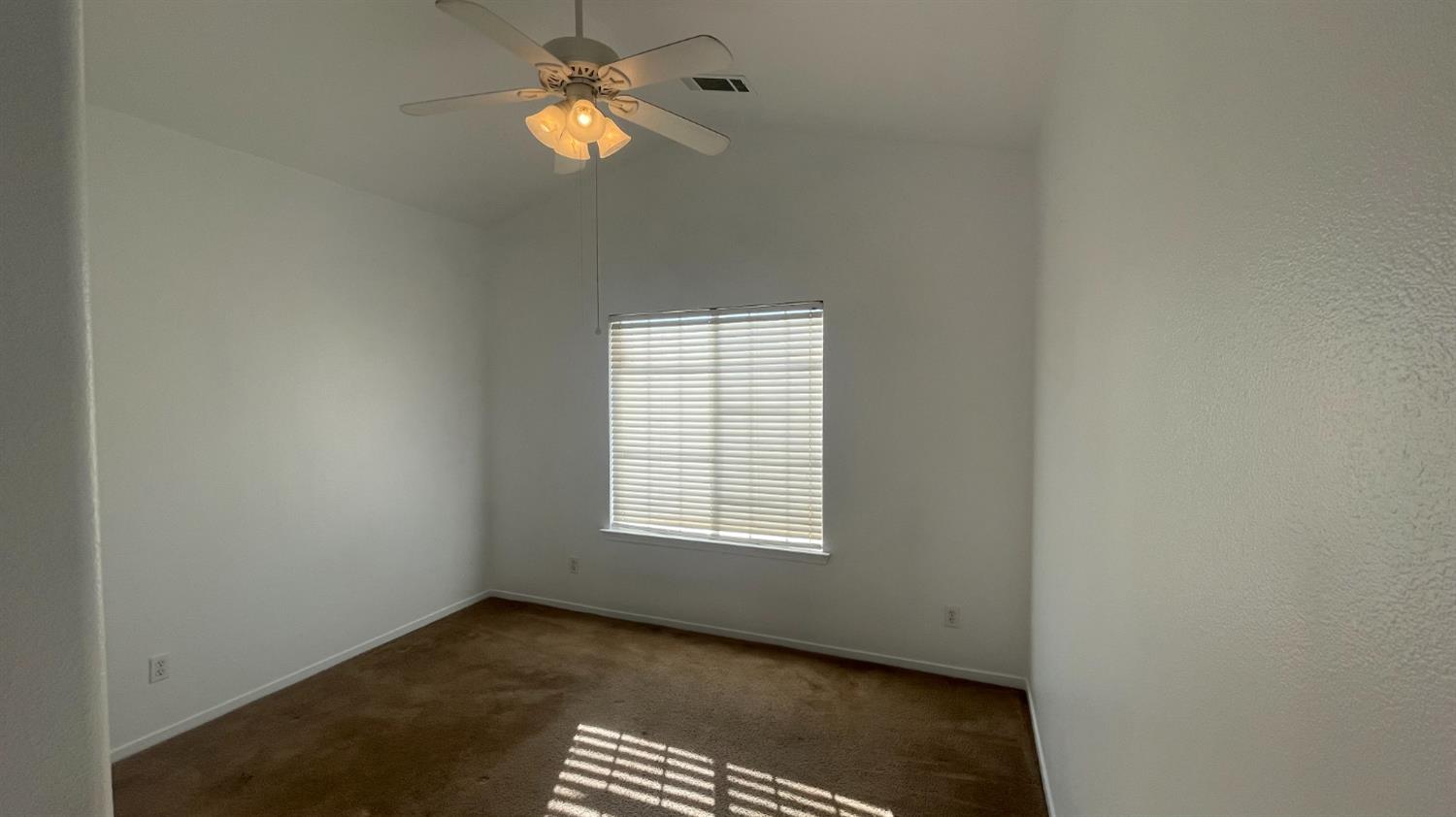 1400 Bay Street Lemoore, CA 93245 - Photo 9 of 21 a view of an empty room with a window