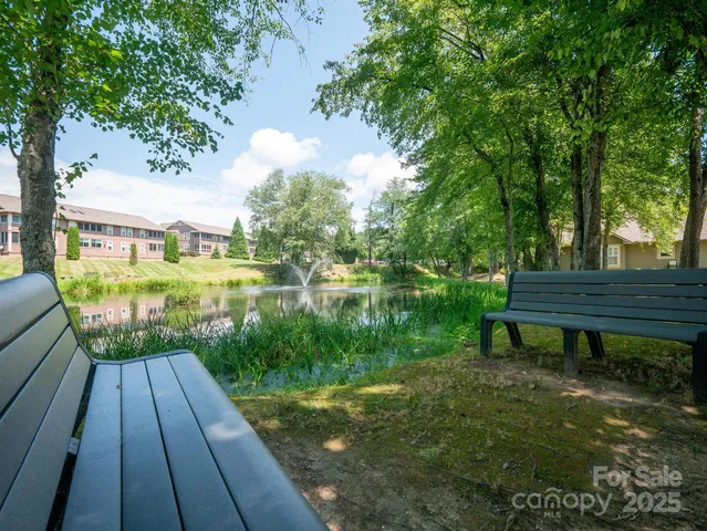 a view of a backyard with sitting area