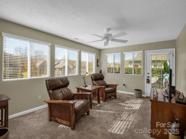 a living room with furniture and windows
