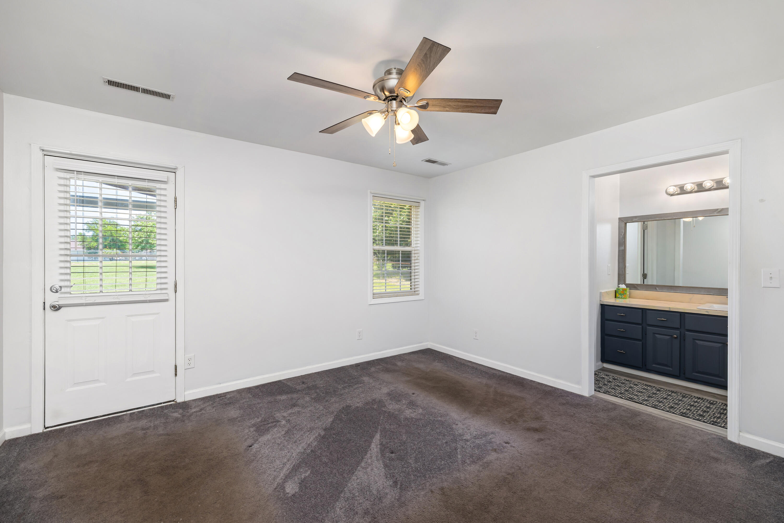 4915 Ridge Street Dalzell, SC 29040 - Photo 22 of 26 Primary bedroom with view leading to the Primary bathroom
