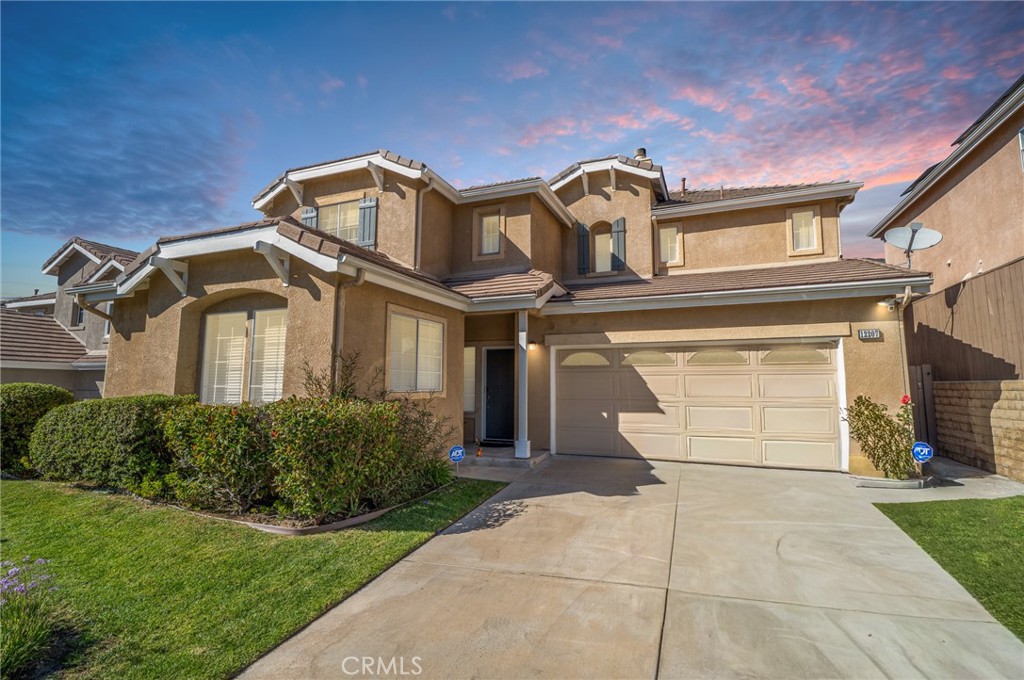 12207 Vía Santa Marta Sylmar, CA 91342 - Photo 1 of 39 a front view of a house with a garden