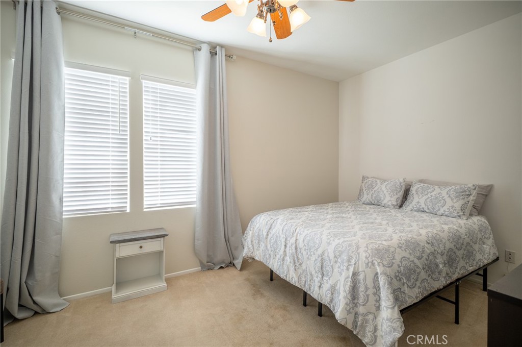 12207 Vía Santa Marta Sylmar, CA 91342 - Photo 11 of 39 a bedroom with a bed and a window