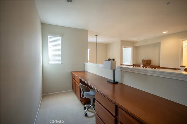 a spacious bedroom with a bed and a couch