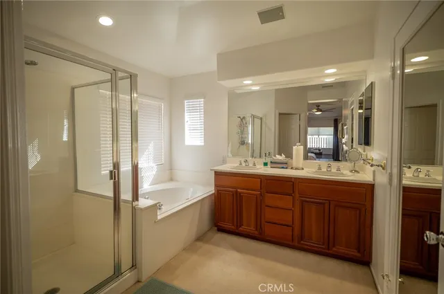 a bathroom with a granite countertop shower mirror and toilet