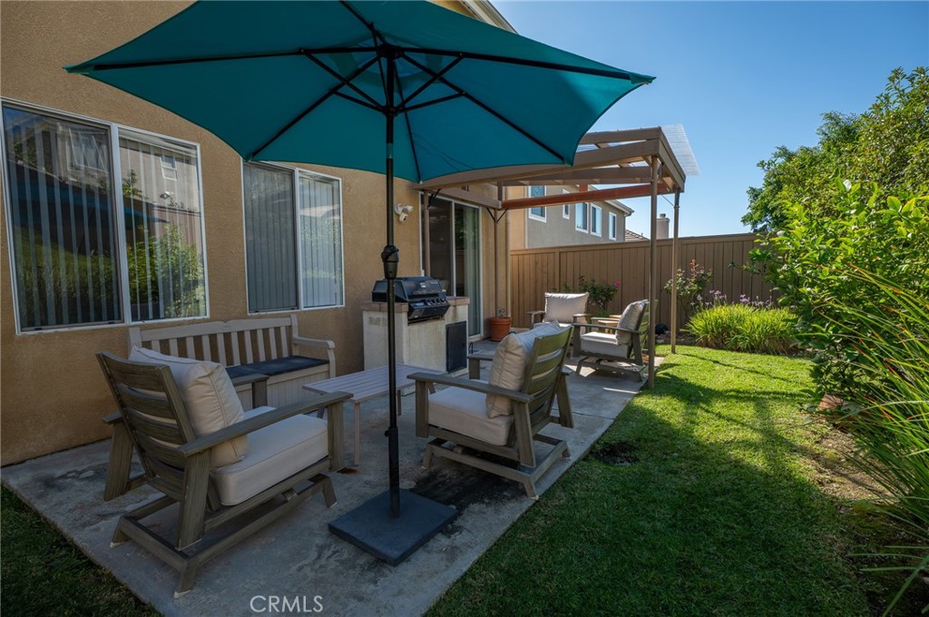 12207 Vía Santa Marta Sylmar, CA 91342 - Photo 37 of 39 a view of a chair and tables in the back yard