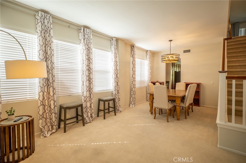 12207 Vía Santa Marta Sylmar, CA 91342 - Photo 8 of 39 a dining room with furniture and a window