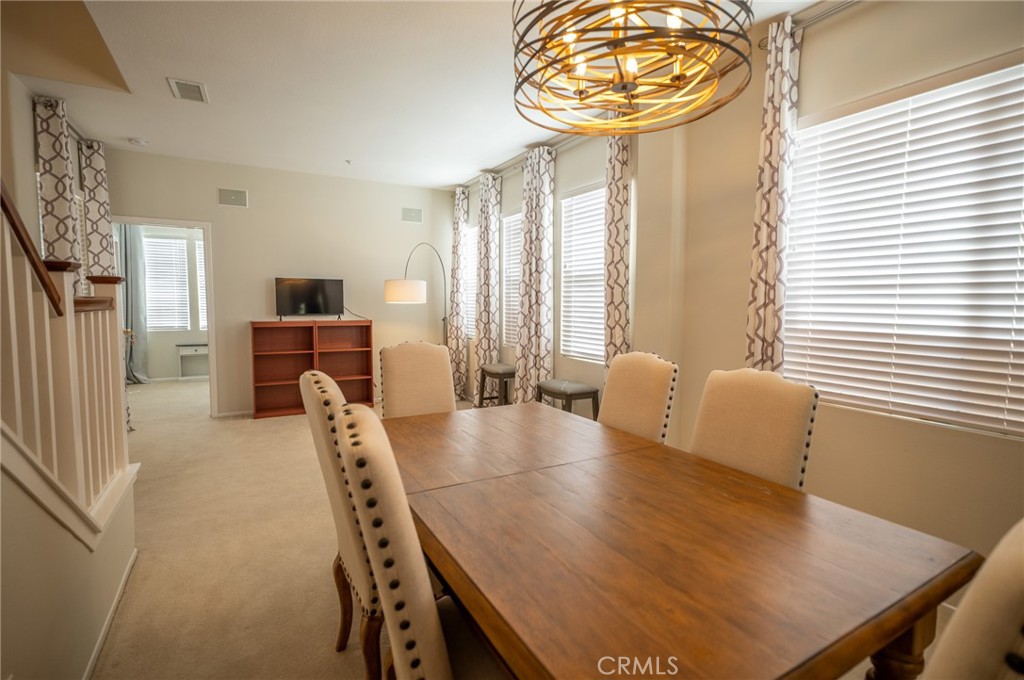 12207 Vía Santa Marta Sylmar, CA 91342 - Photo 10 of 39 a view of a dining room with furniture and a large window
