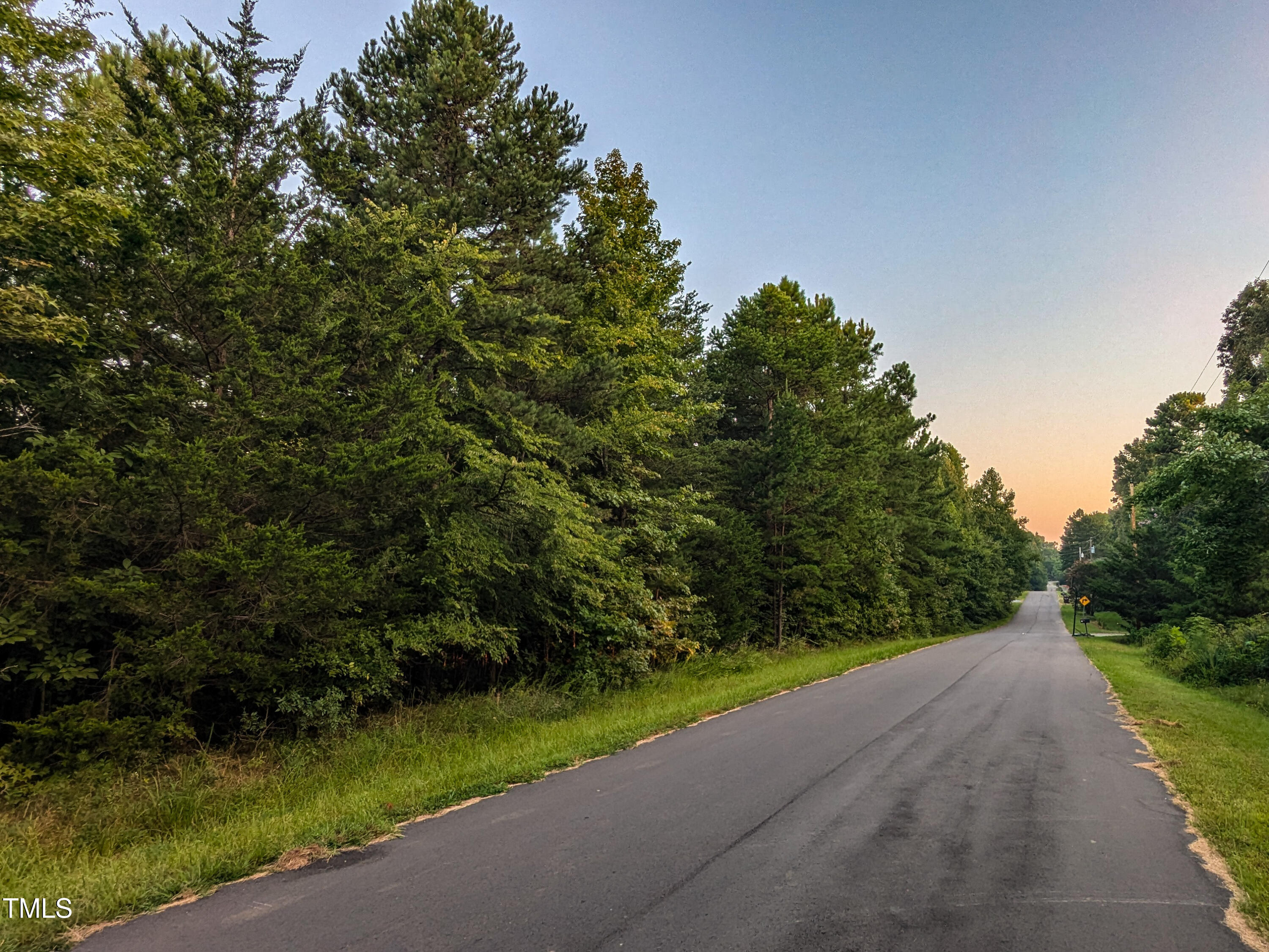 a view of a road with a yard