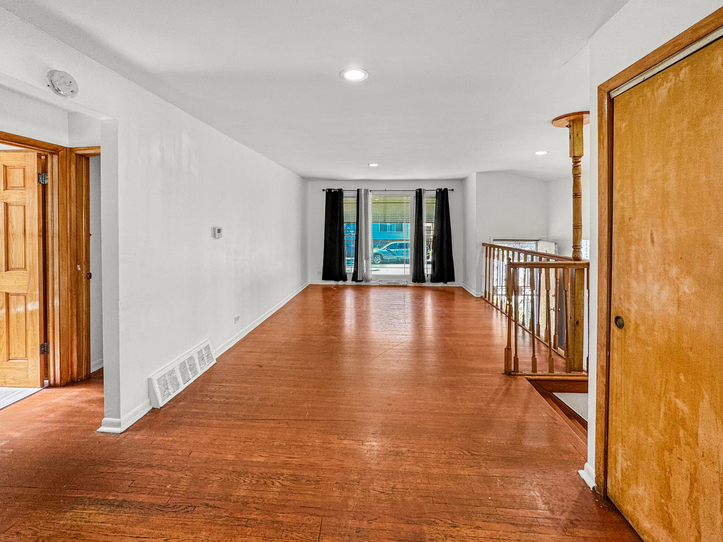 13059 Honore Street Blue Island, IL 60406 - Photo 4 of 15 wooden floor in an empty room with a window