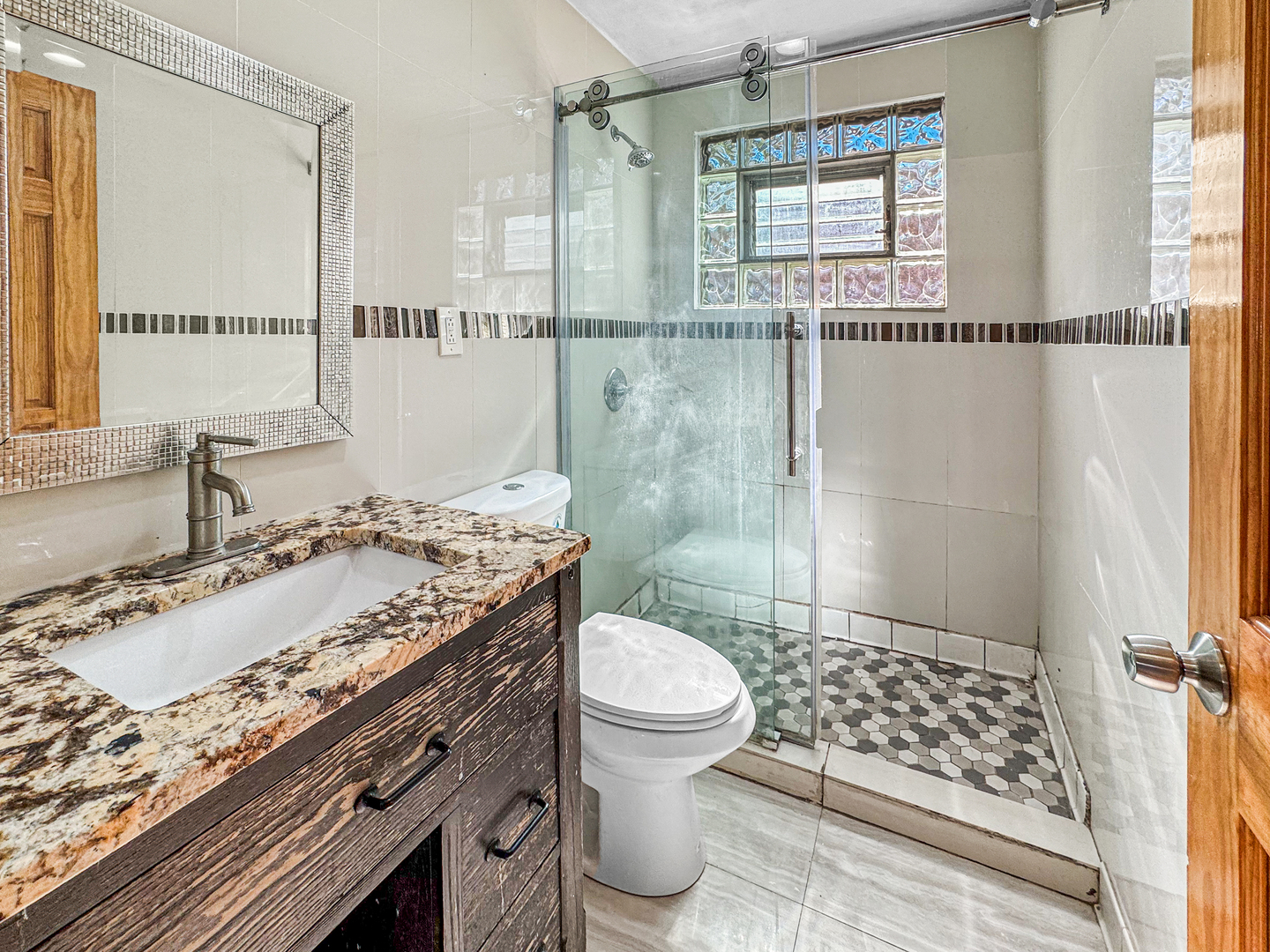 13059 Honore Street Blue Island, IL 60406 - Photo 7 of 15 a bathroom with a sink toilet and shower