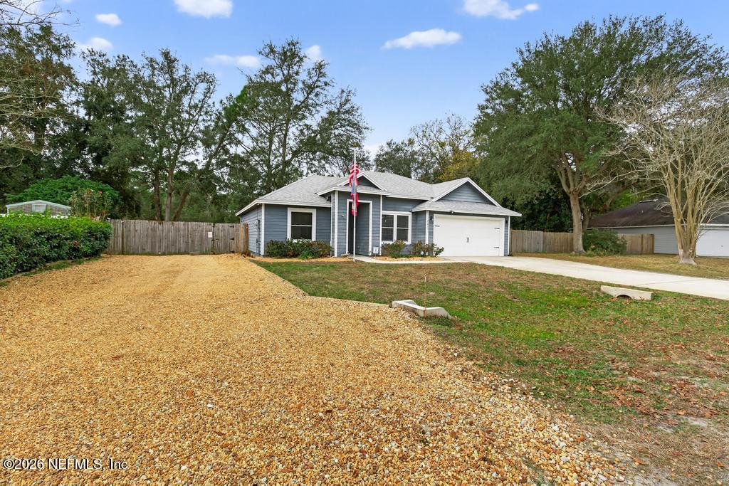 86093 Santa Barbara Street Yulee, FL 32097 - Photo 2 of 51 a house with swimming pool in front of it