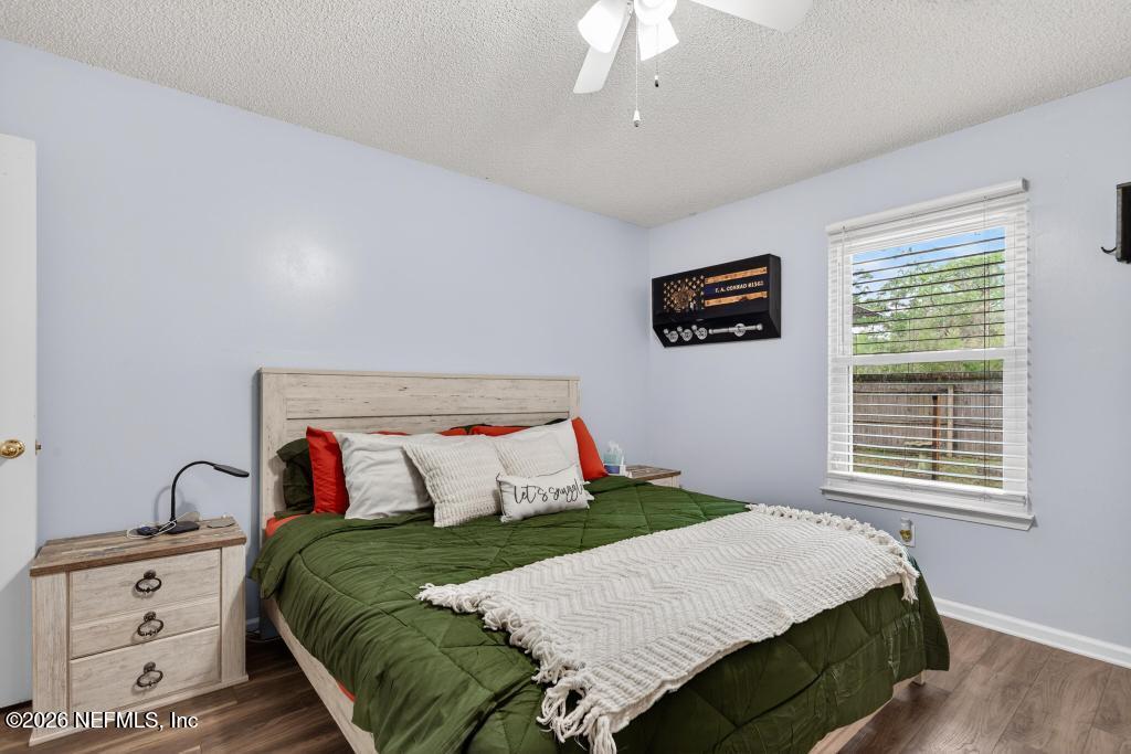 86093 Santa Barbara Street Yulee, FL 32097 - Photo 38 of 51 a bedroom with a bed and a tv