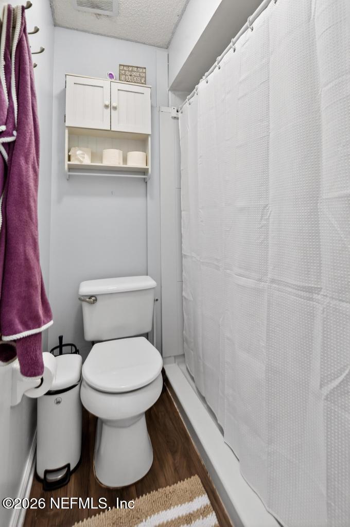 86093 Santa Barbara Street Yulee, FL 32097 - Photo 43 of 51 a bathroom with a toilet and a shower