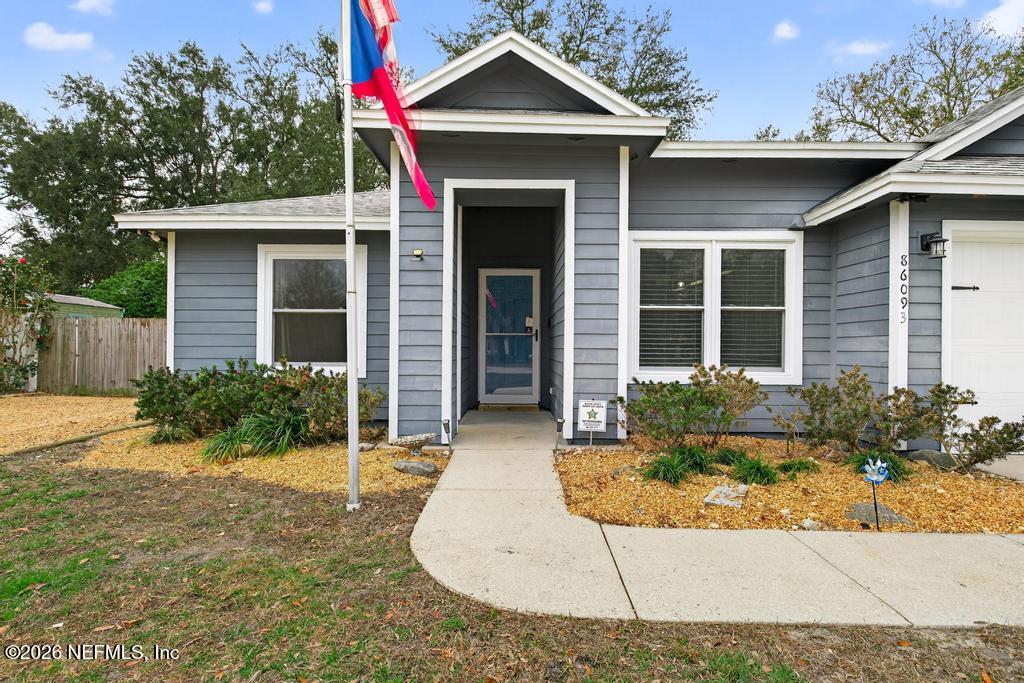 86093 Santa Barbara Street Yulee, FL 32097 - Photo 7 of 51 a front view of a house with garden