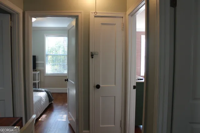 a view of a bathroom from a hallway