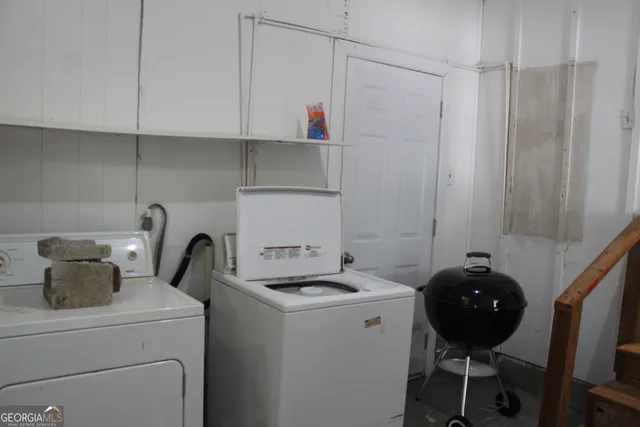 a kitchen with a refrigerator and a stove