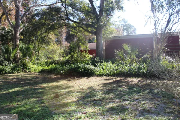 a view of a backyard of a house