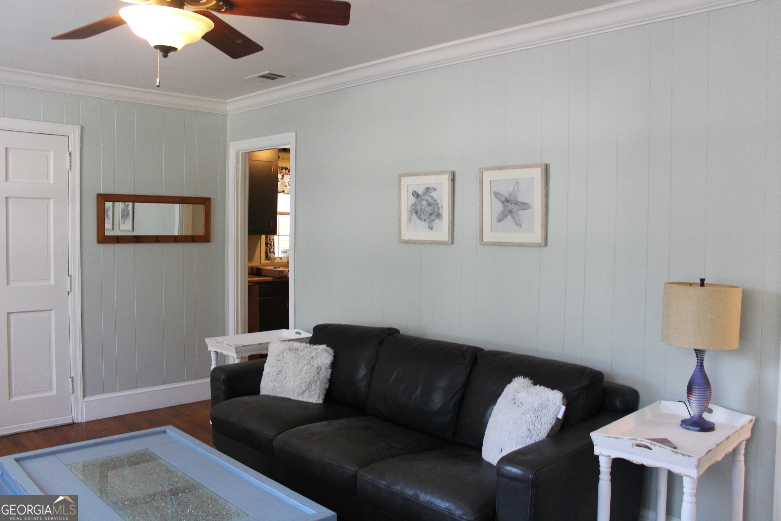 504 Bailey Street St. Marys, GA 31558 - Photo 6 of 22 a living room with furniture and a lamp