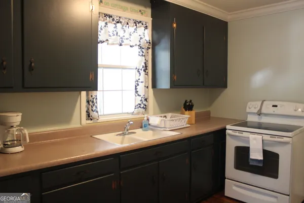 a kitchen with a sink and a window