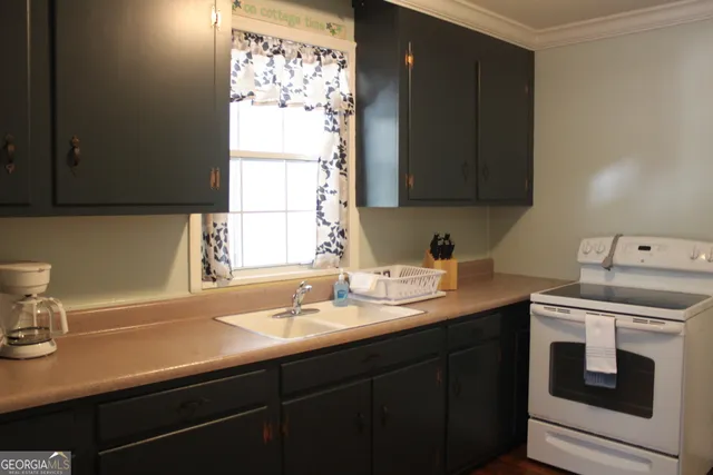 a kitchen with a sink and a window