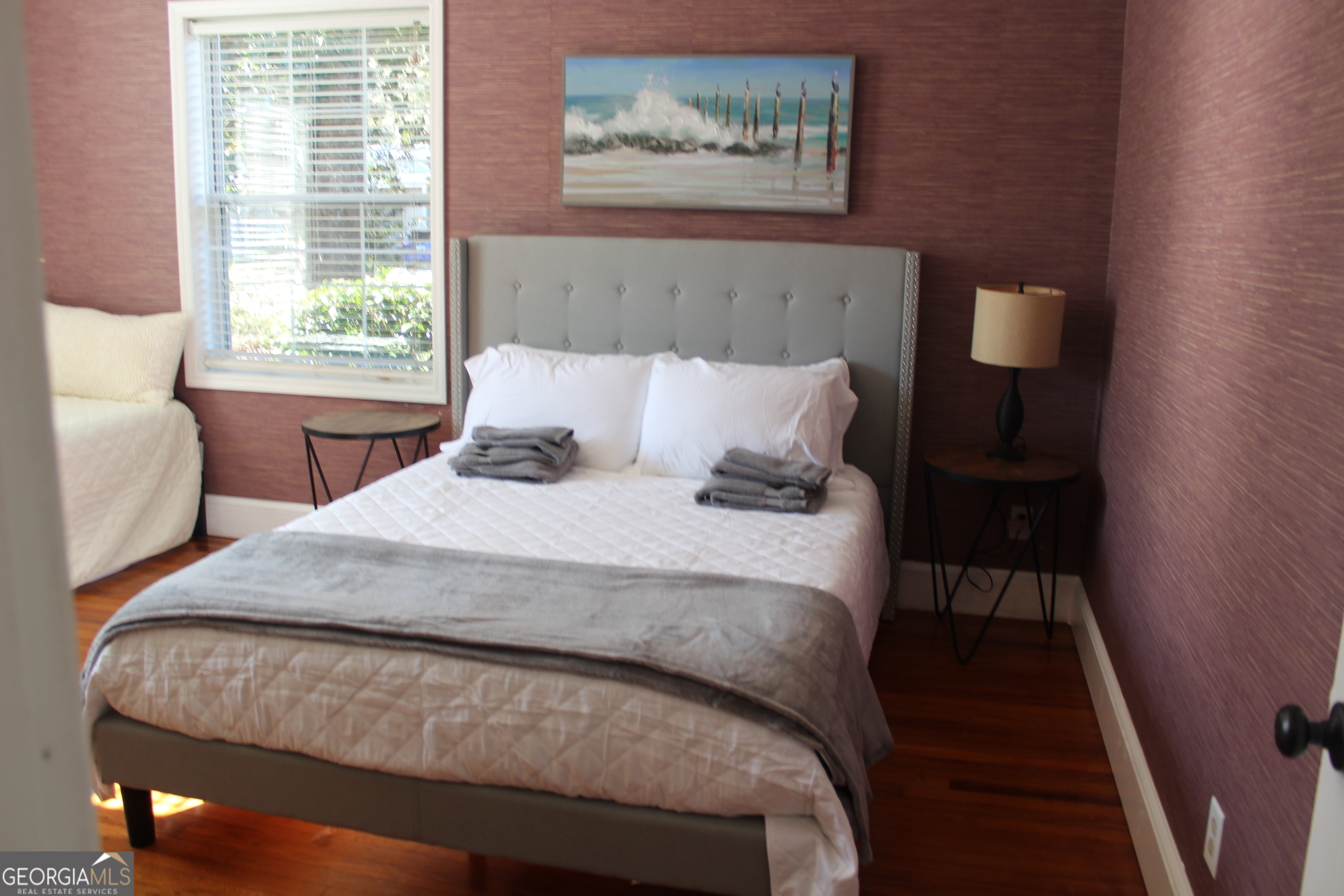 504 Bailey Street St. Marys, GA 31558 - Photo 9 of 22 a bedroom with a bed and window