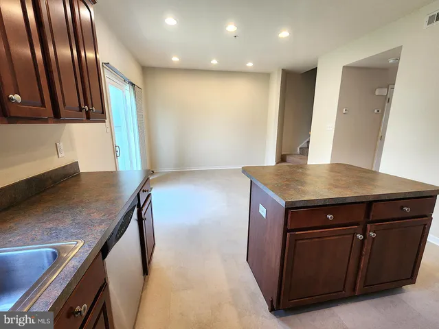 a view of kitchen island with wooden floor