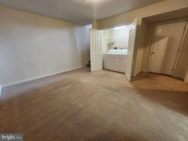 an empty room with a bathroom