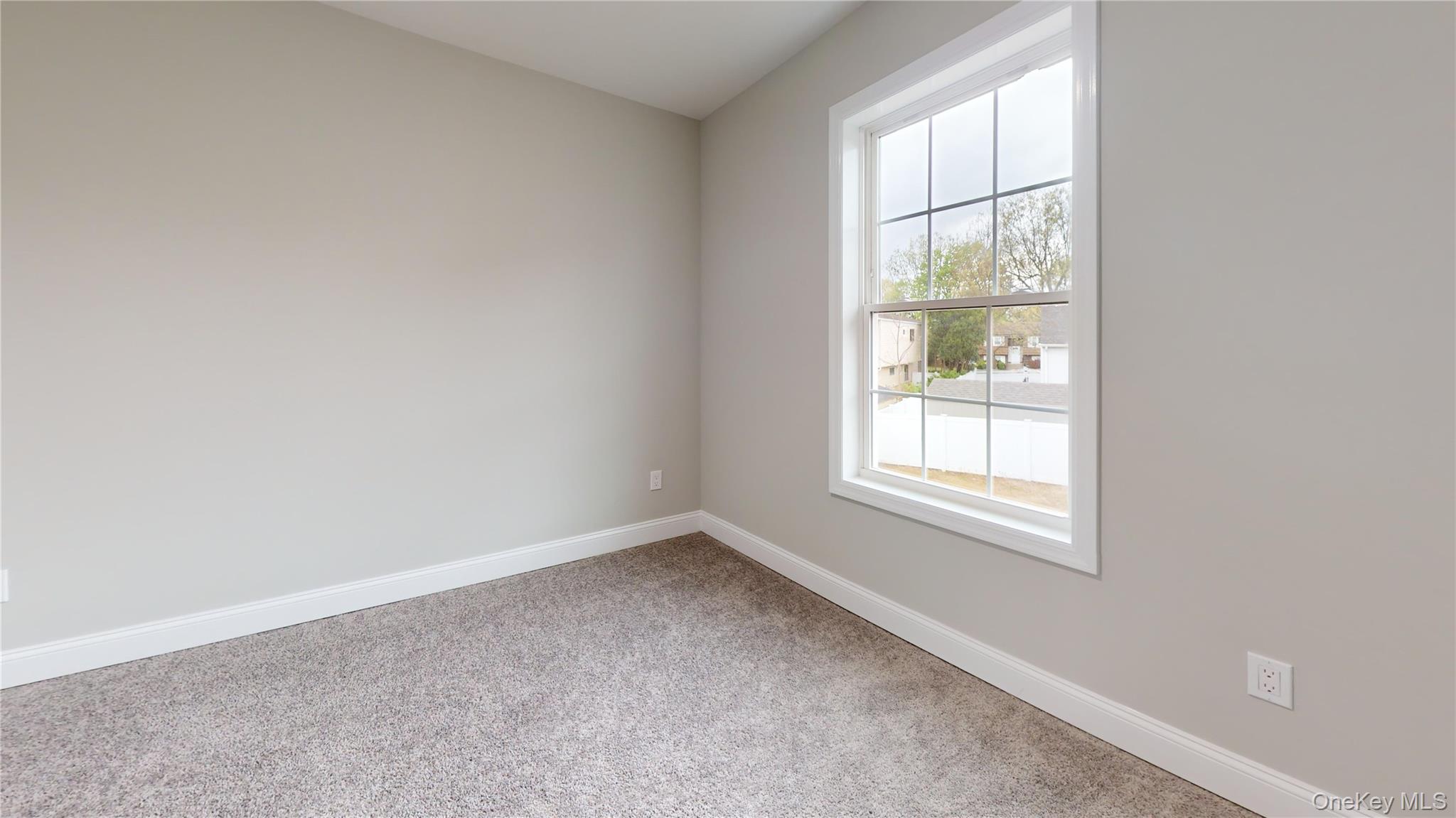 492 Blue Point Road Farmingville, NY 11738 - Photo 15 of 21 an empty room with a window