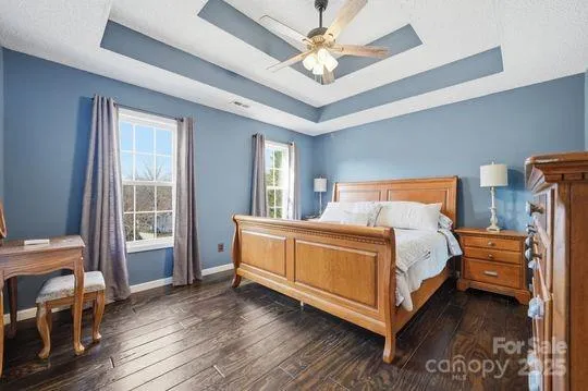 a bed room with a bed and a chair