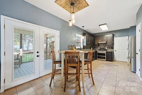 a view of a dining room kitchen and a window