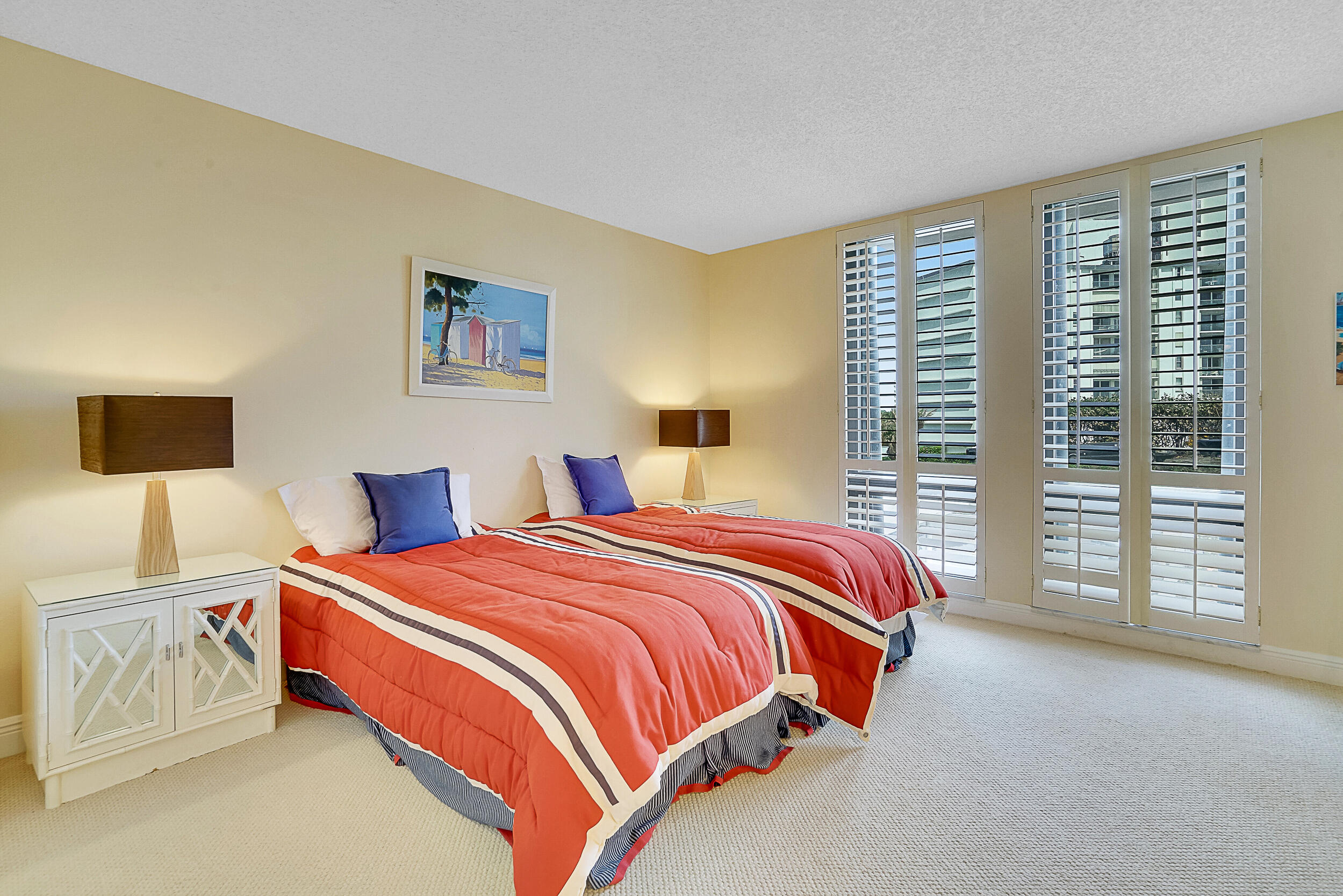 5380 North Ocean Drive, Unit 2I Singer Island, FL 33404 - Photo 13 of 32 a bedroom with bed and a night stand