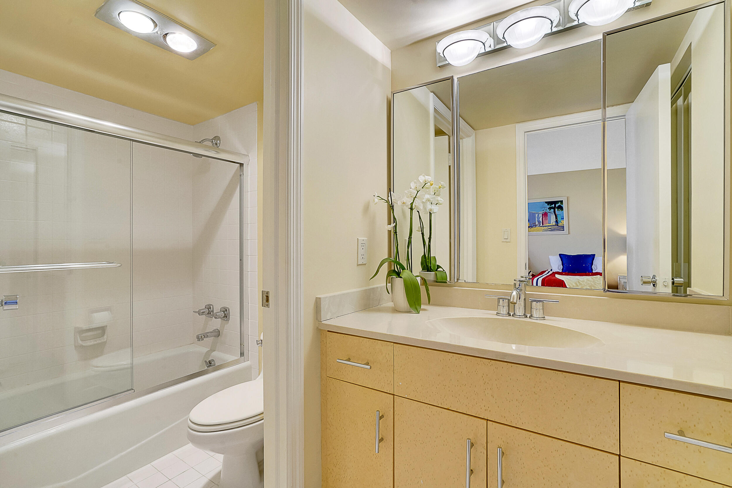 5380 North Ocean Drive, Unit 2I Singer Island, FL 33404 - Photo 14 of 32 a bathroom with a bathtub shower sink vanity and toilet
