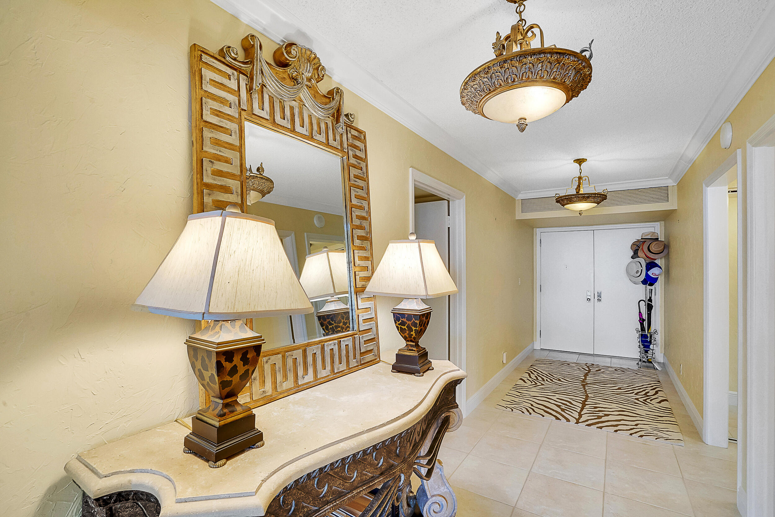 5380 North Ocean Drive, Unit 2I Singer Island, FL 33404 - Photo 20 of 32 a view of a livingroom with furniture and a chandelier