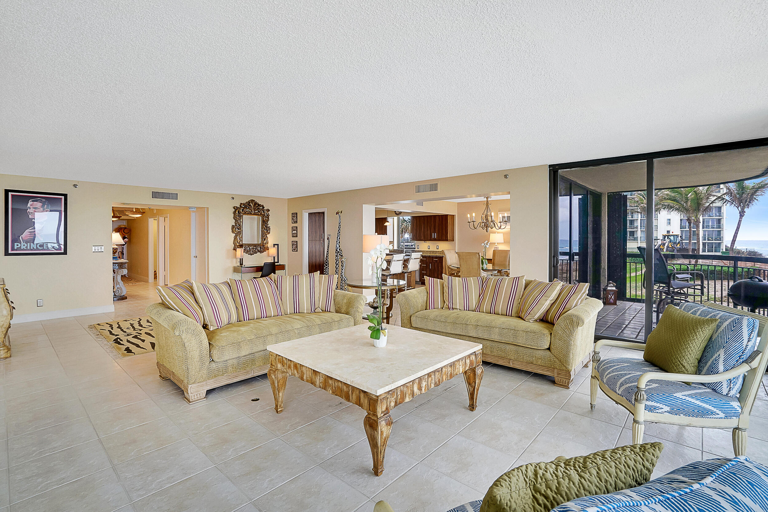 5380 North Ocean Drive, Unit 2I Singer Island, FL 33404 - Photo 10 of 32 a living room with furniture and a table