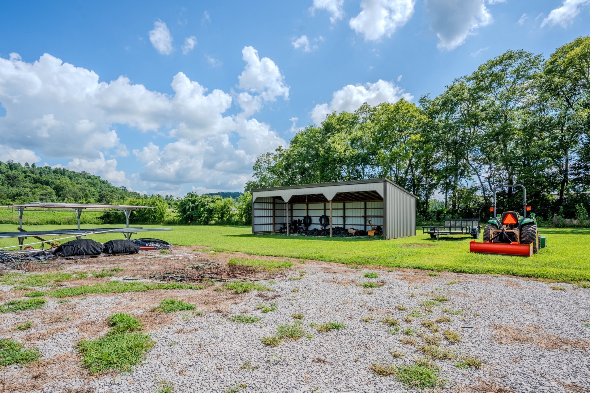 2461 Bodenham Road Pulaski, TN 38478 - Photo 28 of 59 a view of a house with a big yard and large trees