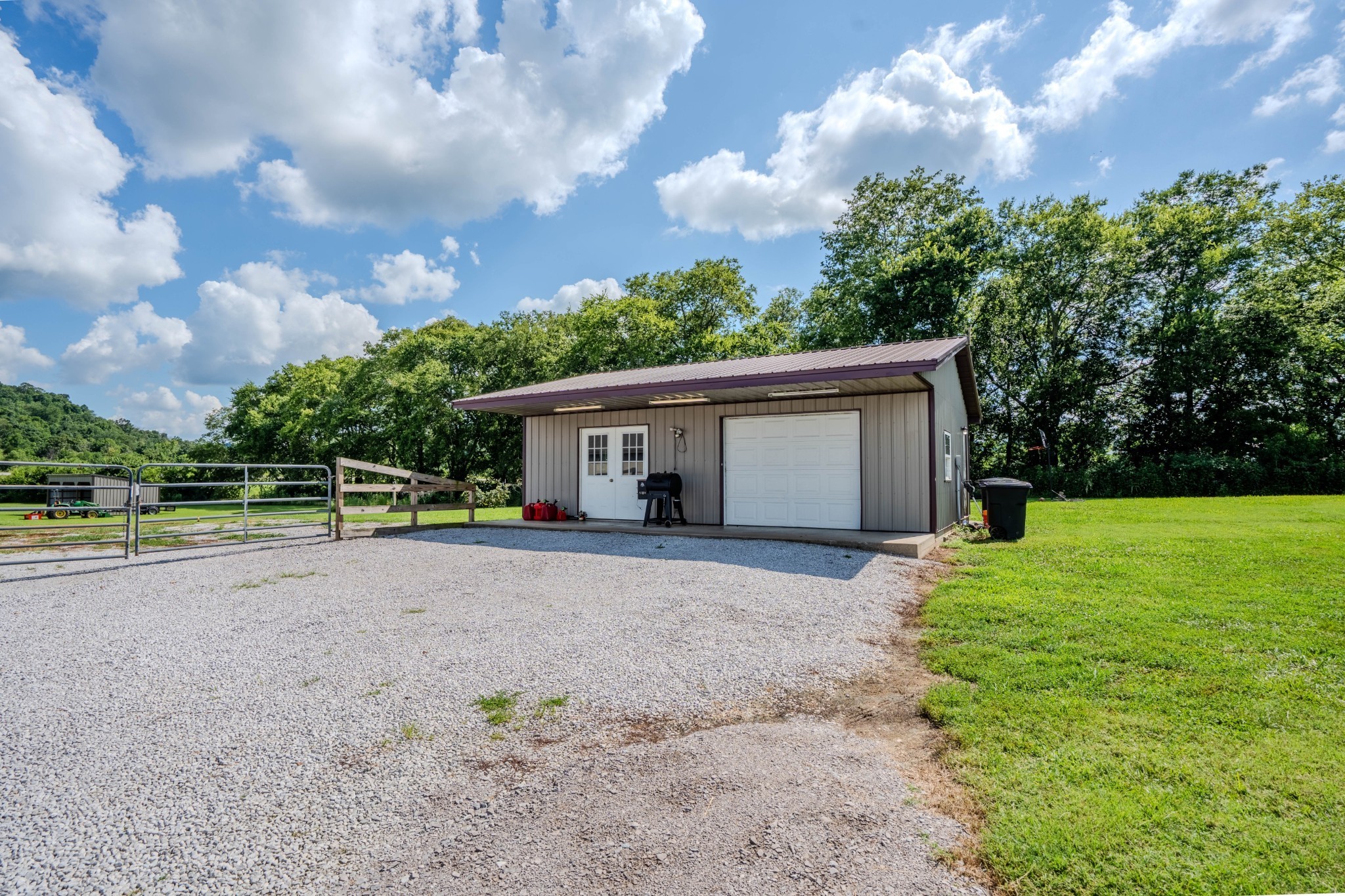 2461 Bodenham Road Pulaski, TN 38478 - Photo 30 of 59 a view of a house with backyard and trees