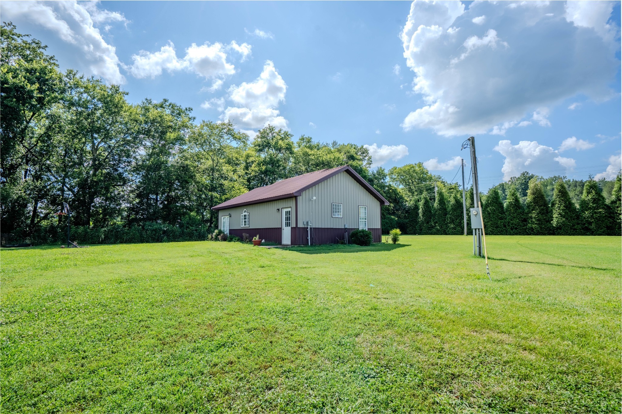 2461 Bodenham Road Pulaski, TN 38478 - Photo 47 of 59 a house with huge green field in front of it