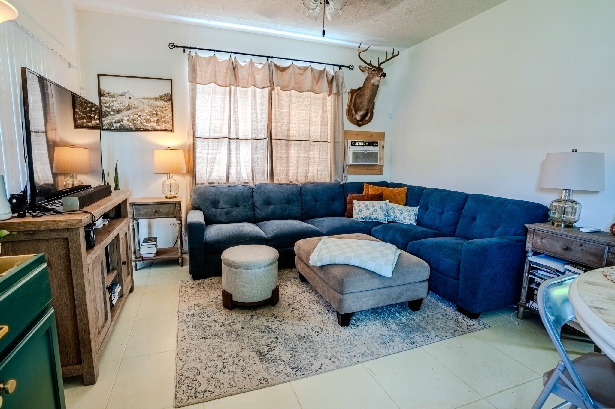 2461 Bodenham Road Pulaski, TN 38478 - Photo 51 of 59 a living room with furniture a flat screen tv and a window