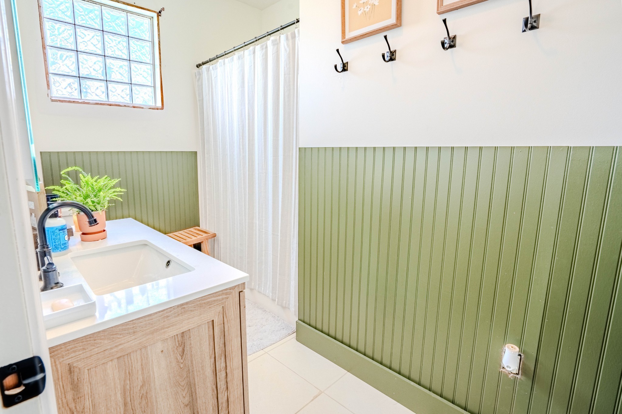2461 Bodenham Road Pulaski, TN 38478 - Photo 53 of 59 a bathroom with a sink a mirror and a shower curtain