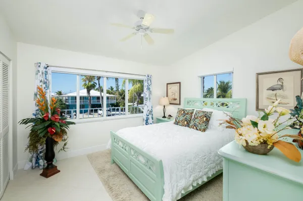 a bathroom with a sink mirror and vanity