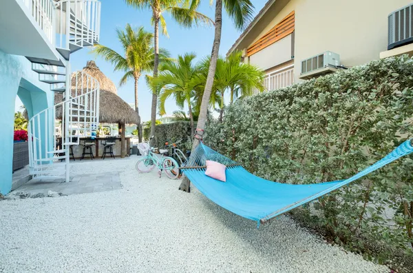 a view of a chairs and table in the patio