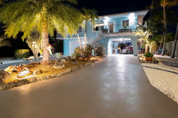 a front view of house with yard and outdoor seating