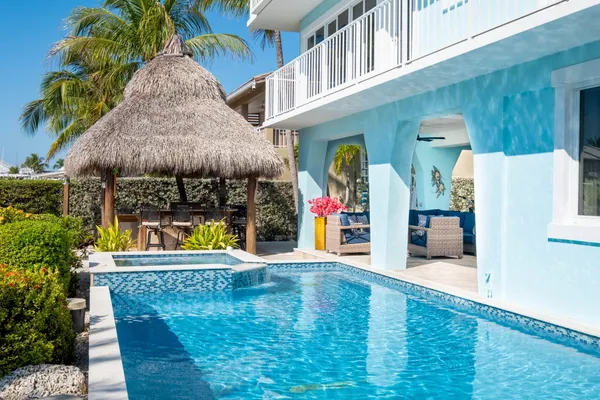 a living room with furniture and flowers