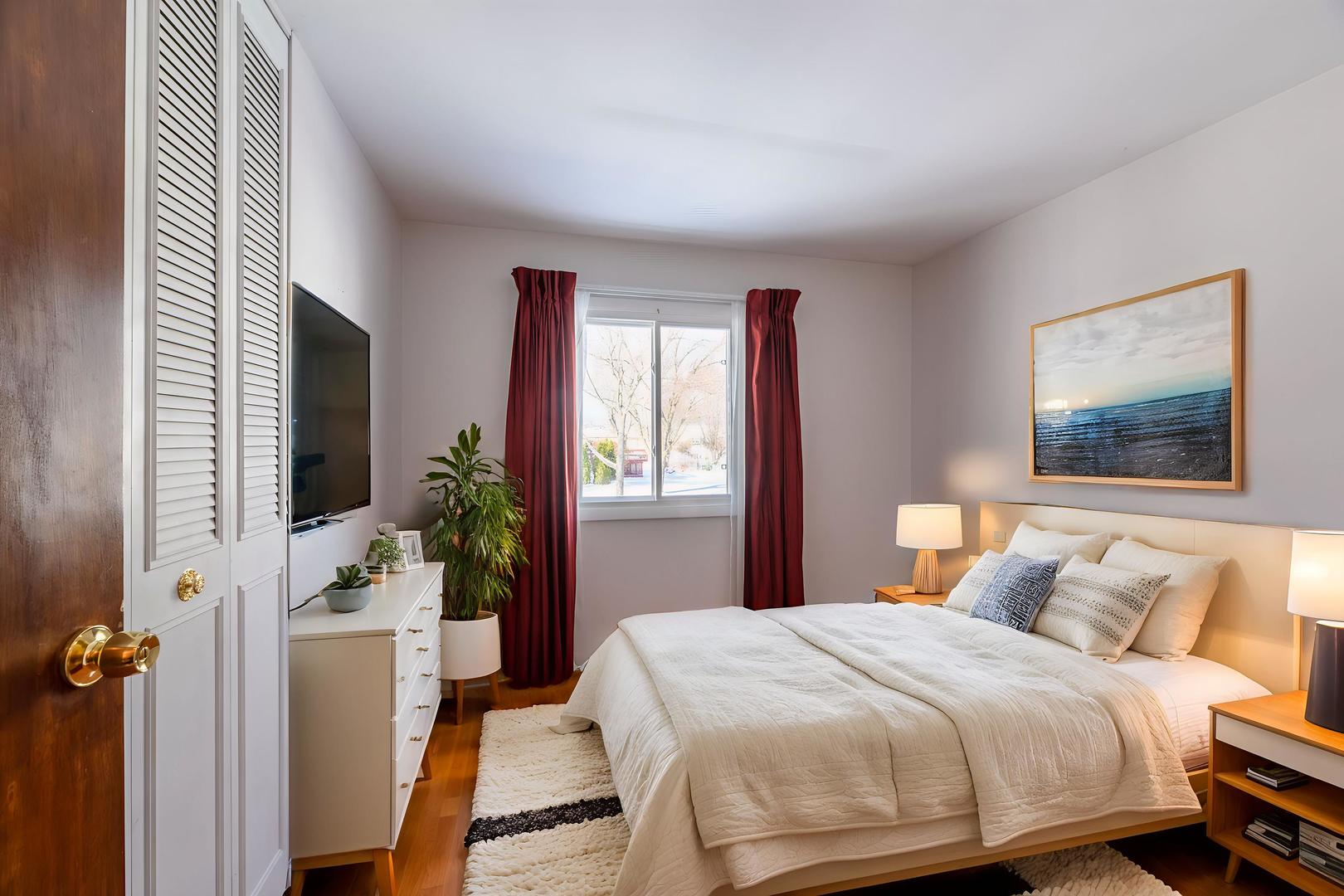795 Plymouth Road Hoffman Estates, IL 60192 - Photo 11 of 26 a bedroom with a bed and a window