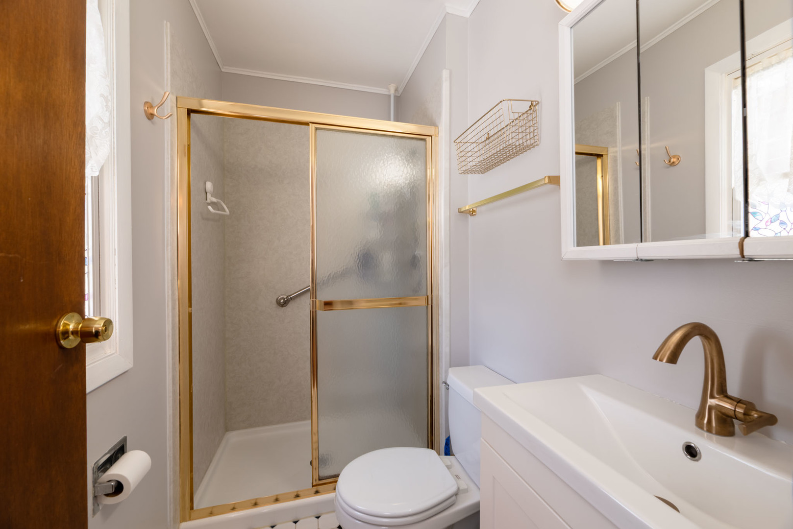 795 Plymouth Road Hoffman Estates, IL 60192 - Photo 18 of 26 a bathroom with a sink toilet and shower