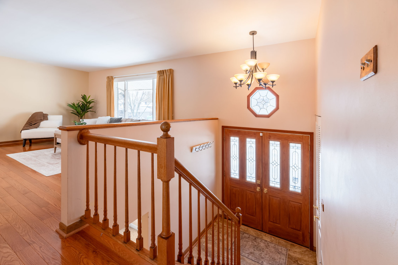 795 Plymouth Road Hoffman Estates, IL 60192 - Photo 2 of 26 a view of a hallway with window and stairs