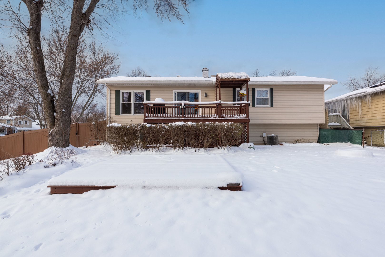 795 Plymouth Road Hoffman Estates, IL 60192 - Photo 25 of 26 a view of a house with snow on the road